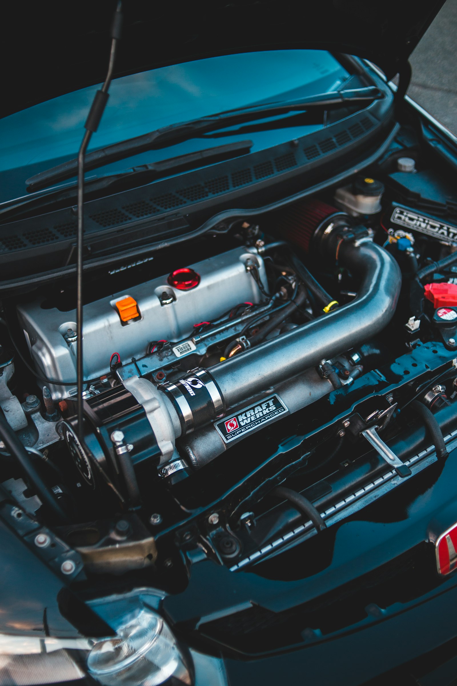 Polished aluminium charge piping and intercooler installed in an engine bay